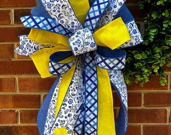 Zomerkrans, strik, geel en blauw lint