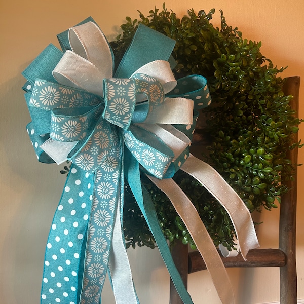 Teal polkadot and floral bow.