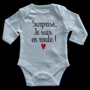 Personalized unisex baby bodysuits ideal for a pregnancy announcement &quot;Surprise I&#39;m on my way!&quot;