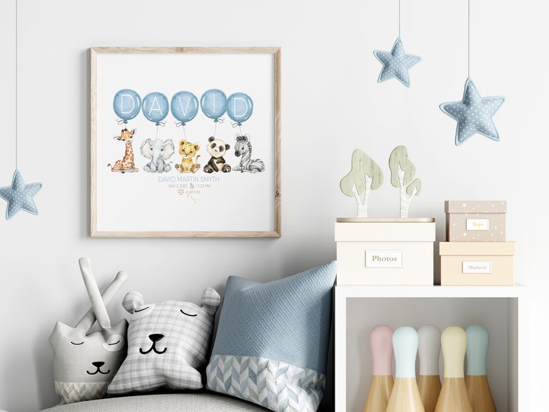 May include: A framed print featuring watercolor illustrations of a giraffe, elephant, lion cub, panda, and zebra. The word "DAVID" is written in blue letters on balloons. Below the animals is the text "DAVID MARTIN SMITH".