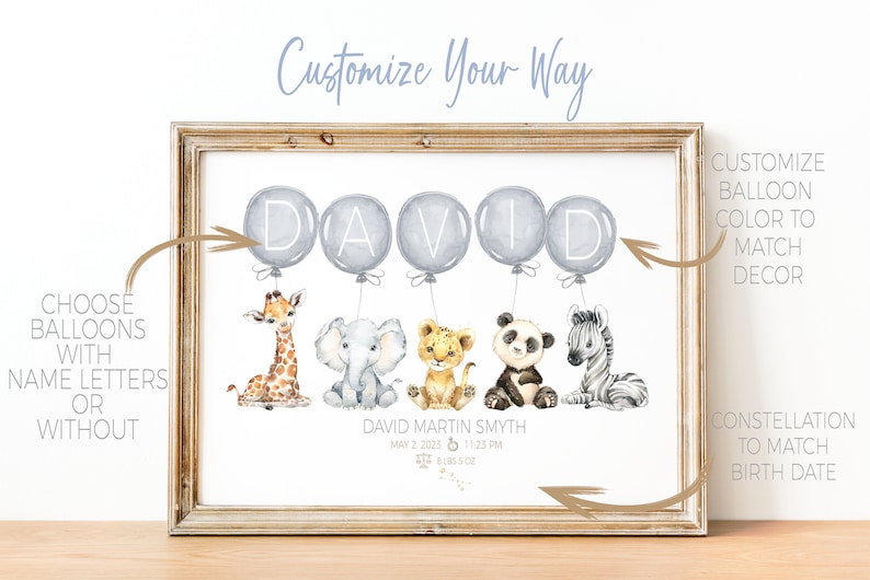 May include: A framed watercolor print featuring the name "DAVID" in gray balloons above animal illustrations. The print includes a giraffe, elephant, lion, panda, and zebra. Text at the bottom reads "DAVID MARTIN SMYTH" with birth details.