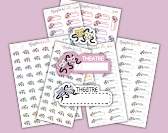 May include: A collection of sticker sheets with a theater theme. The stickers feature drama masks and the word "THEATRE" in various designs and colors, including pink, purple, and yellow. The stickers are arranged on a light pink background.