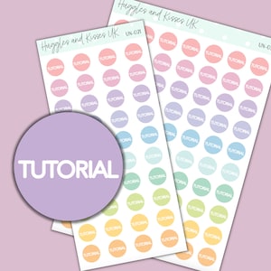 May include: A sheet of pastel coloured round stickers with the word "TUTORIAL" printed in white on each sticker. The stickers are arranged in rows and columns.