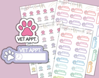May include: A set of colorful paw print stickers with the text "VET APPT."  The stickers are designed for use in a planner or journal to mark veterinary appointments.