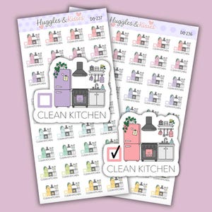 May include: Two sticker sheets labelled Huggles & Kisses featuring small illustrations of a kitchen with a refrigerator, stove, and sink. Each sticker includes a checkbox and the text CLEAN KITCHEN. The stickers come in various pastel colours.