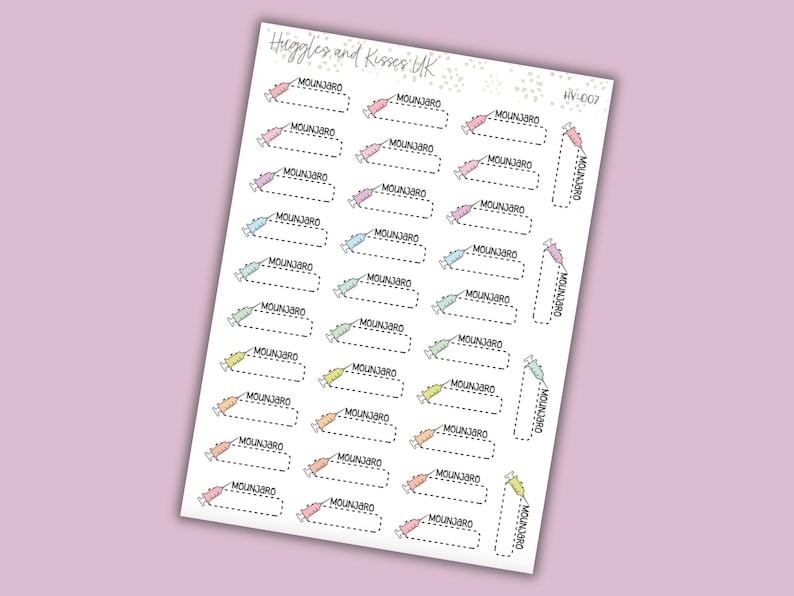 May include: A sheet of stickers with a light purple background. The stickers feature a syringe design in various pastel colors, each with the word "MOUNJ3RO" above a dotted rectangle. The sheet has the text "Higgles and Kisses UK" and "IV-007".