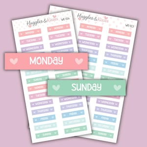 May include: Pastel-coloured sticker sheets with labels for each day of the week, including Monday, Tuesday, Wednesday, Thursday, Friday, Saturday, and Sunday. The stickers have a heart symbol and the text "Huggles & Kisses".