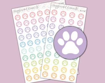 May include: Two sheets of pastel paw print stickers. Each sheet has 36 paw prints in a rainbow of colors. The paw prints are white and outlined in pastel colors. The sheets are labeled "Huggles and Kisses UK" and "BL-042".