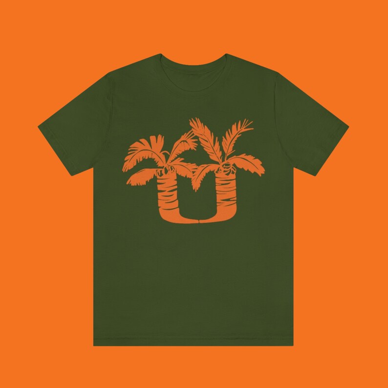 May include: A dark green t-shirt with an orange palm tree design. The palm trees are stylized to form the letter "U".