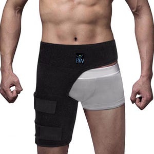 May include: Black hip and thigh support brace with adjustable straps. The brace covers the hip and thigh area, with a cutout for the groin. The brace has a logo that says "BW" in a blue and green design.