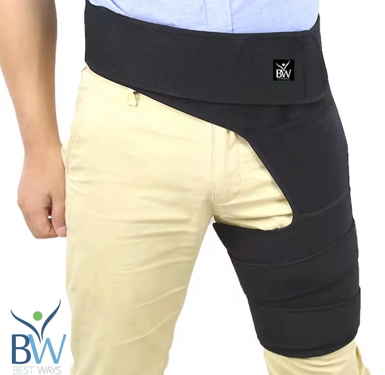 May include: Black hip and thigh support brace. The brace wraps around the hip and thigh, with a velcro closure. The product has the "BW BEST WAYS" logo.