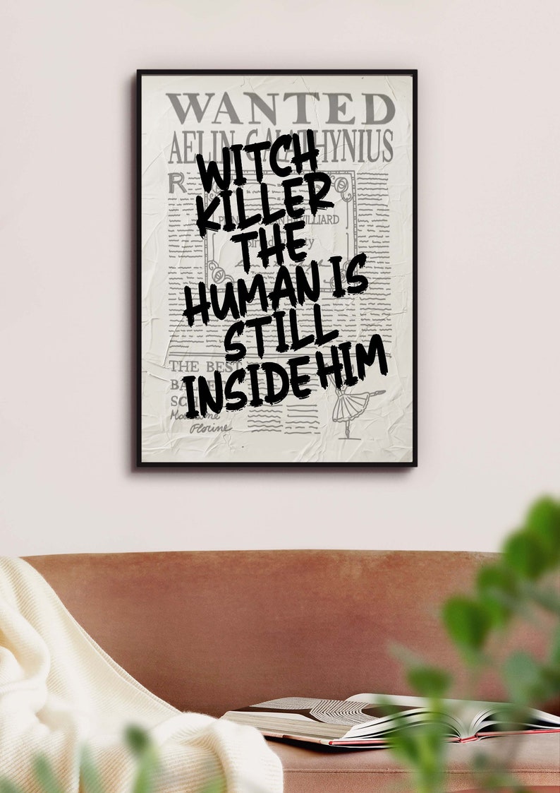 May include: A black and white poster with the text "WANTED" at the top and the text "WITCH KILLER THE HUMAN IS STILL INSIDE HIM" in bold black letters.