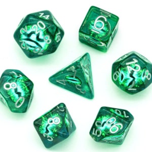 May include: Set of seven green and silver dice with swirling patterns. The dice are numbered 4, 6, 8, 10, 12, 16, and 20.