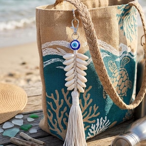 May include: A white ceramic mug with a black handle and the text "But First, Coffee" in a handwritten style. The mug is on a white surface. The mug is 10 cm tall.