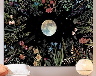 May include: A tapestry featuring a full moon surrounded by a circular arrangement of colorful flowers and leaves on a black background.