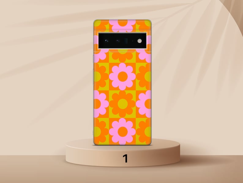 May include: A phone case with a retro-style pattern of orange and pink flowers on a yellow background.