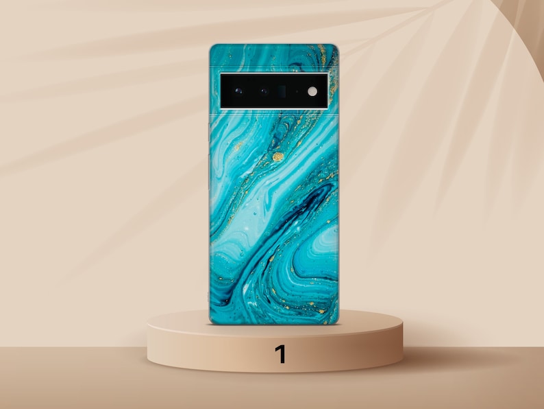May include: A blue and gold marble phone case with a black camera lens.
