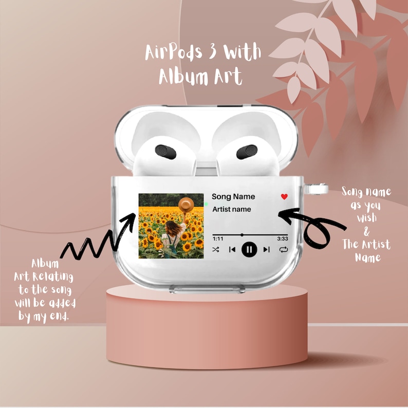 May include: A clear case for AirPods 3 with a sunflower field album art displayed on the screen. The screen shows the song name, artist name, and playback controls. The text "AirPods 3 with Album Art" is displayed above the case.