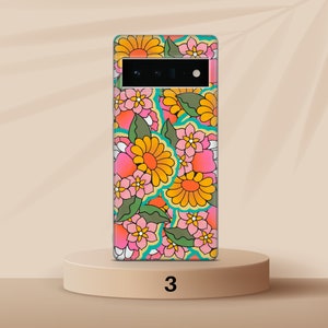 May include: A phone case with a retro floral pattern in shades of pink, yellow, green, and blue. The case features a variety of flowers and leaves.