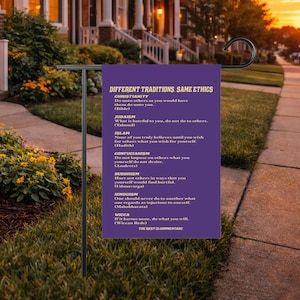 May include: A purple garden flag with the text "DIFFERENT TRADITIONS, SAME ETHICS" and quotes from Christianity, Judaism, Islam, Confucianism, Buddhism, Hinduism, and Wicca. The flag is hanging in a garden.
