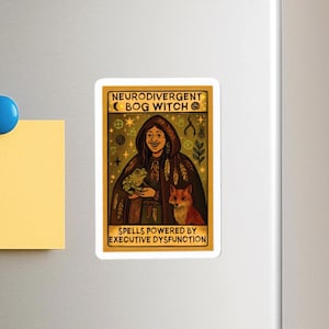 May include: A rectangular sticker featuring a cartoon illustration of a person in a hooded cloak holding a frog and with a fox. The text reads "NEURODIVERGENT BOG WITCH" and "SPELLS POWERED BY EXECUTIVE DYSFUNCTION". The color palette includes gold, brown, and green.