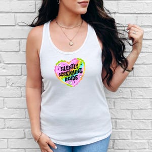 A racerback tank top with the phrase "Silently Screaming Inside" printed in bold, perfect for introverts and anyone navigating life with sarcasm and dry humor.