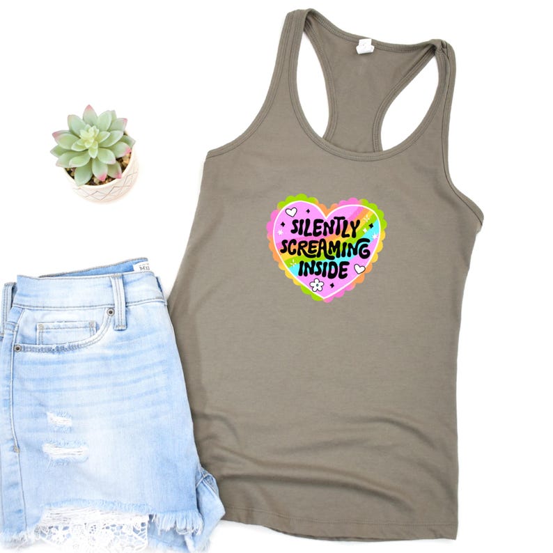 A racerback tank top with the phrase "Silently Screaming Inside" printed in bold, perfect for introverts and anyone navigating life with sarcasm and dry humor.