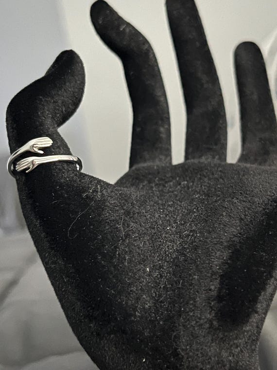 Sterling Silver Hug Ring: Adjustable Embrace Gest… - image 1