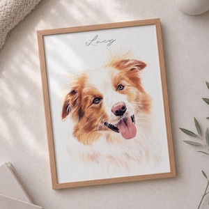 May include: A framed portrait print featuring a watercolor-style illustration of a brown and white dog with its tongue out. The name Lucy is written in black cursive script above the dog's head. The artwork is encased in a light wood frame.