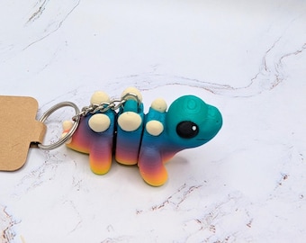 Llavero articulado flexible impreso en 3D de Stegosaurus