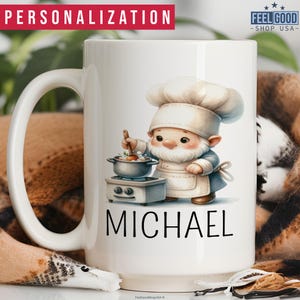 May include: White ceramic mug featuring a cartoon chef with a white hat and apron, cooking in a small pot. The name "MICHAEL" is printed below the chef illustration. The mug has a large handle and the text "PERSONALIZATION" is at the top.