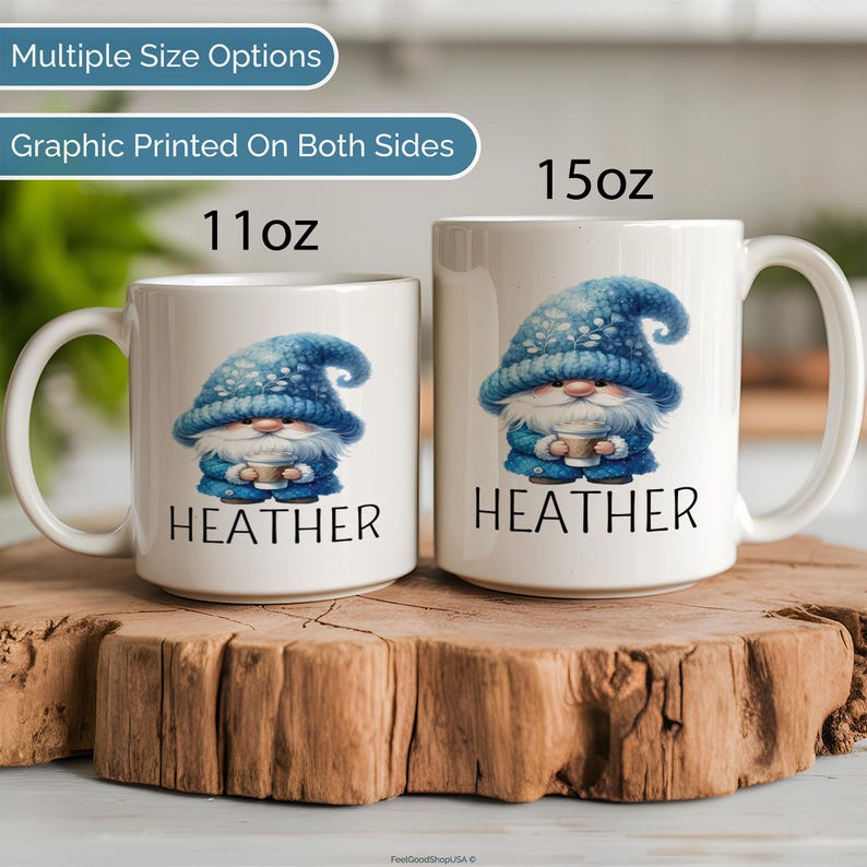 May include: Two white ceramic mugs with a blue gnome graphic and the name 'HEATHER' printed on them. The mugs are sitting on a wooden surface. The mugs are available in two sizes: 11 oz and 15 oz.