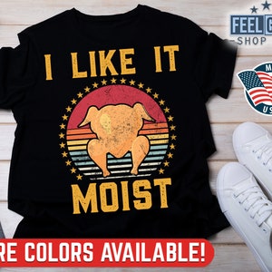 May include: Black t-shirt with a vintage-style graphic of a roasted turkey with the text "I Like It Moist".