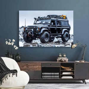 May include: A black Land Rover Defender with a roof rack and a yellow and black luggage carrier. The vehicle is parked on a snowy, rocky surface.