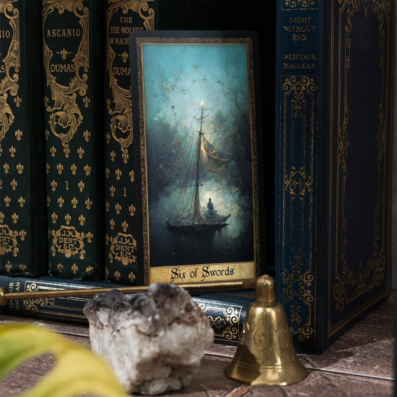 May include: A tarot card with a blue and green background depicting a boat sailing on a body of water. The card is titled "Six of Swords".