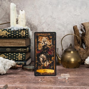 The Death card from the Wonderland Shadows Tarot Deck, illustrating a transformative scene with dark yet elegant motifs, reflecting endings and new beginnings in a Wonderland-themed setting.