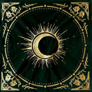May include: A green velvet square with a gold crescent moon and sunburst design. The design is surrounded by a gold ornate border.