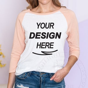 District  |  DM136L  |  Women’s Perfect Tri 3/4 Sleeve  |   Raglan |  Heathered Peach / White | Mockup
