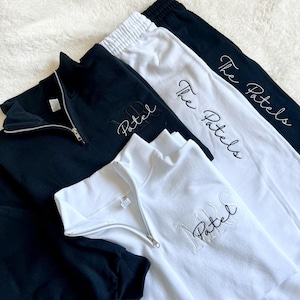 May include: Three black and white sweatshirts with embroidered text. One sweatshirt says "Mr. Patel", another says "Mrs. Patel", and the third says "The Patels".