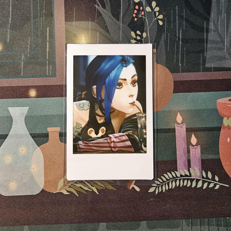 May include: An anime character with blue hair and a pink and black outfit is looking to the right. The character is holding a straw in their mouth and is wearing a black choker necklace.