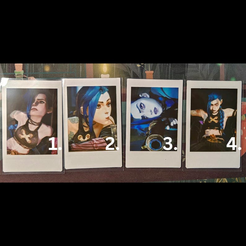 May include: Four Polaroid photos of a woman with blue hair in different poses. The photos are numbered 1 through 4.