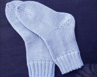 Handmade baby socks knitted from 100% merino wool yarn. Soft, warm and hypoallergenic. Suitable from one to two years of age