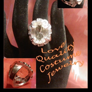 solid 1980's costumer jewelry ring is a huge pastel peach/yellow. Ships Free