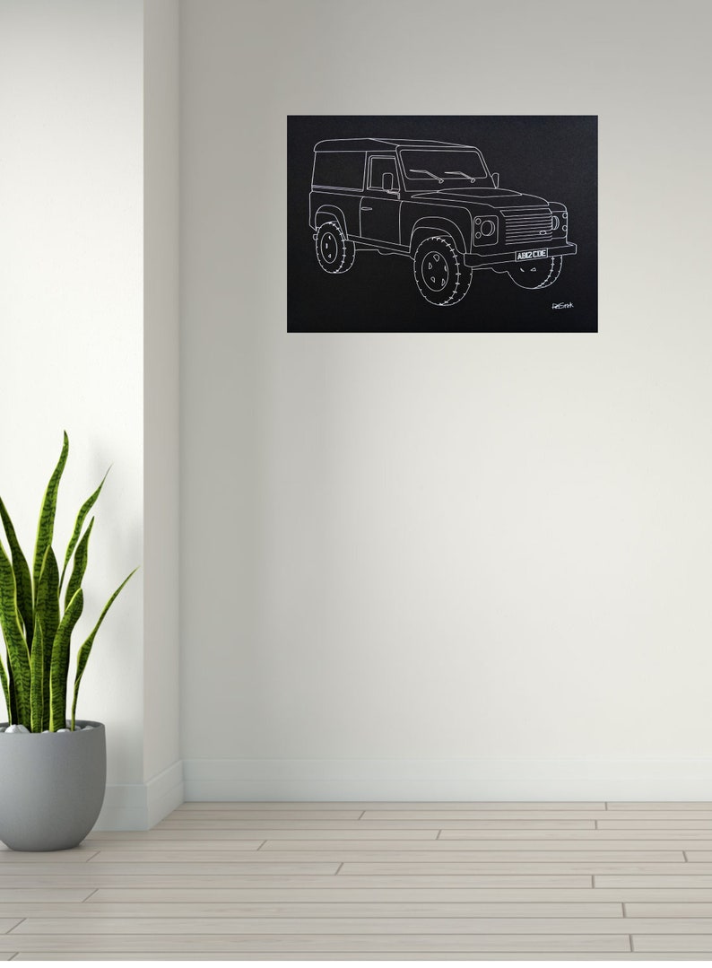May include: Black canvas art print featuring a white line drawing of a Land Rover Defender. The artwork shows the vehicle's profile, including wheels, windows, and headlights. The license plate reads "ABC 123".