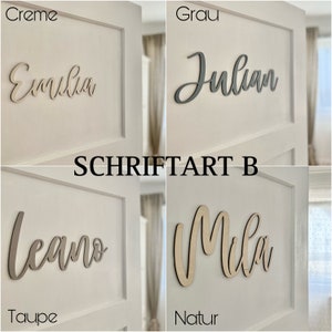 May include: Four wooden name signs with different names and colors. The names are "Emilia", "Julian", "Leano", and "Mila". The colors are creme, gray, taupe, and natural wood.