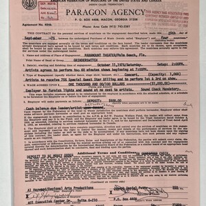 May include: A vintage contract from Paragon Agency, dated September 29, 1975, for a concert engagement at the Paramount Theater in Palm Beach, Florida. The document includes details about the band Grinderswitch, performance times, and financial terms. The contract is on pink paper.