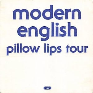May include: A white square with the words "modern english pillow lips tour" in blue, bold font. The word "otto" is in a small circle at the bottom. The image is a promotional item for a music tour.