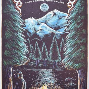 May include: A concert poster for Yonder Mountain String Band at The Fillmore on April 10 and 11, 2009. The illustration features a dark night scene with a full moon, snow-capped mountains, pine trees, a campfire, and a bear by a lake.