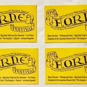May include: Four yellow fliers with black text announcing "The 2nd Consecutive Migration of the Great American HORDE Festival". The fliers list the bands performing: Blues Traveler, Widespread Panic, Big Head Todd and the Monsters, Col. Bruce Hampton & the Aquarium Rescue Unit, The Samples, Allgood, and special guests.