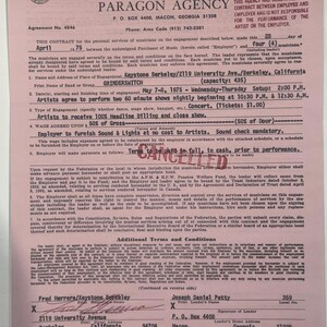 May include: A vintage contract from 1975 between Paragon Agency and Grinderswitch for a concert at Keystone Berkeley. The document is pink with black text, detailing performance terms, including payment and sound check. The contract is signed by Fred Herrera and Joseph Daniel Petty.